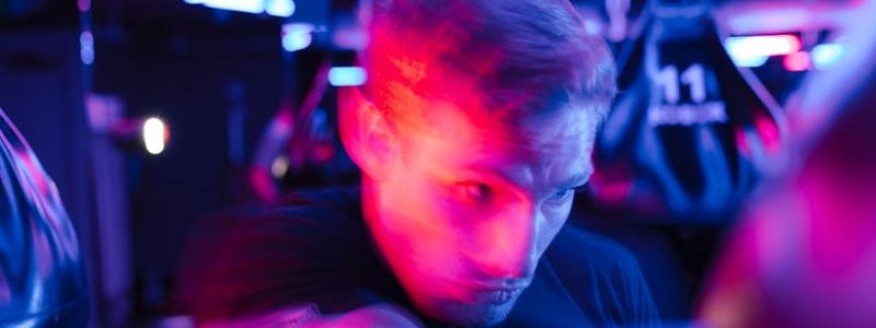 Blurred motion of a person performing cardio exercises indoors